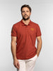 Polo manica corta in cotone piqué con patch ruggine